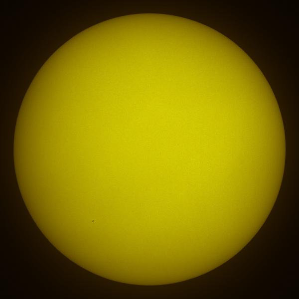 This is our Sun. The little black dots in the bottom left are the silhouettes of the Space Shuttle Atlantis and the Hubble Space Telescope on May13 2009.