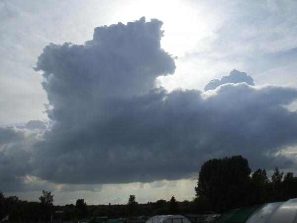 Today we had a nice big thunderstorm with the full works. This was it in its early stages, building up over the city before it really got going about an hour later.